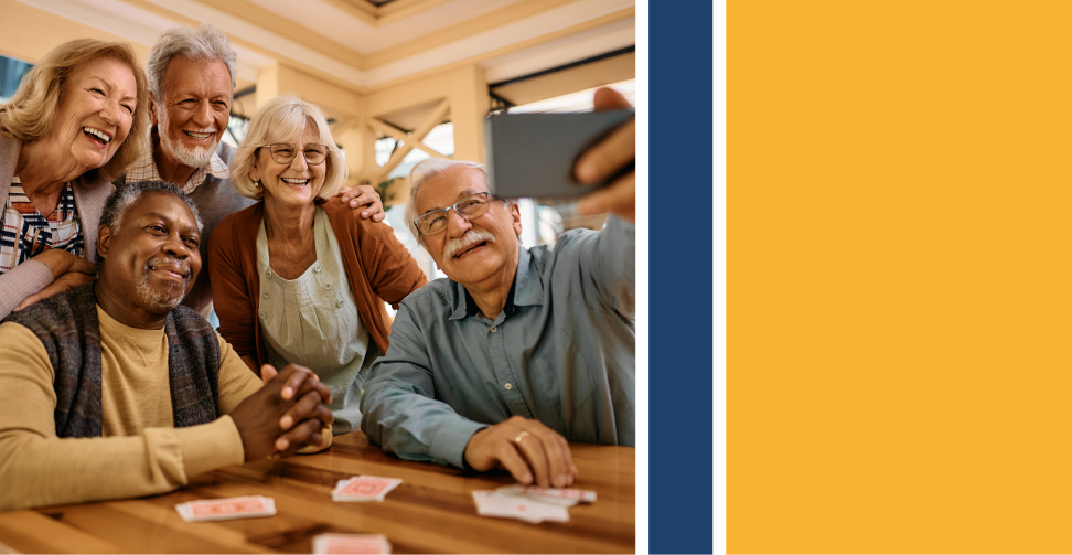 Cheerful senior have fun while taking selfie at retirement community