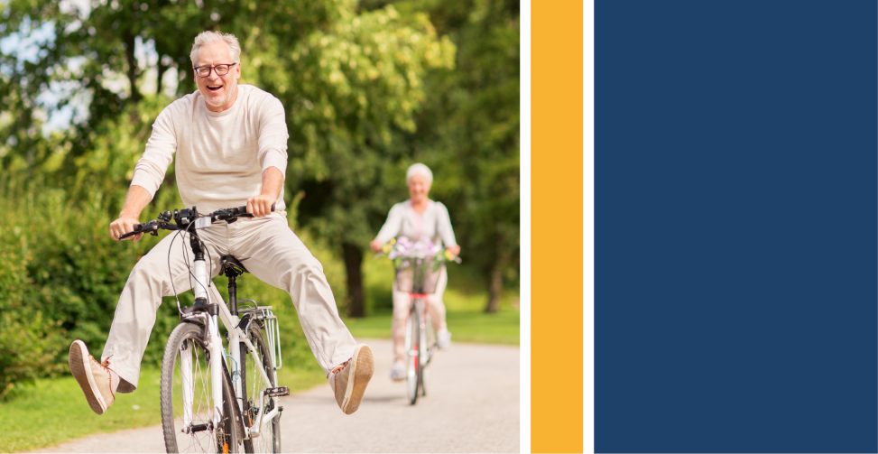 happy senior couple riding bicycles at summer park