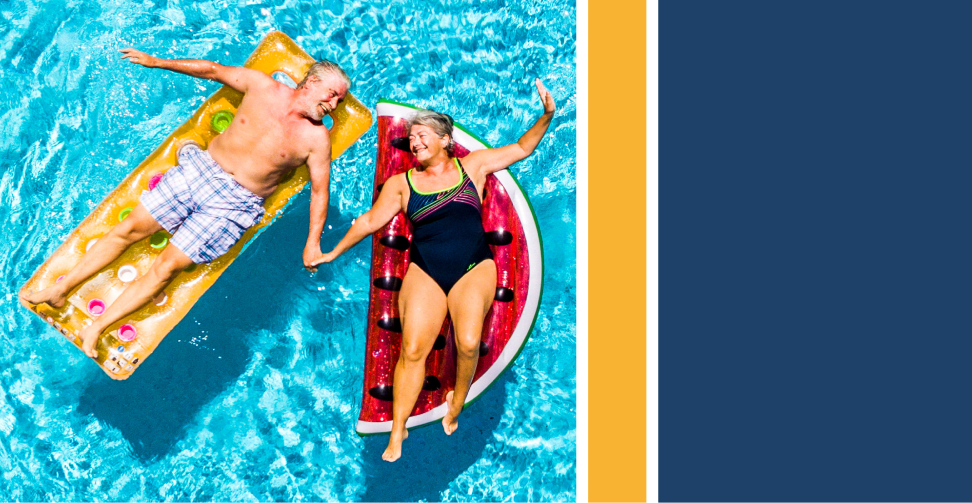 middle age couple floating on swimming pool